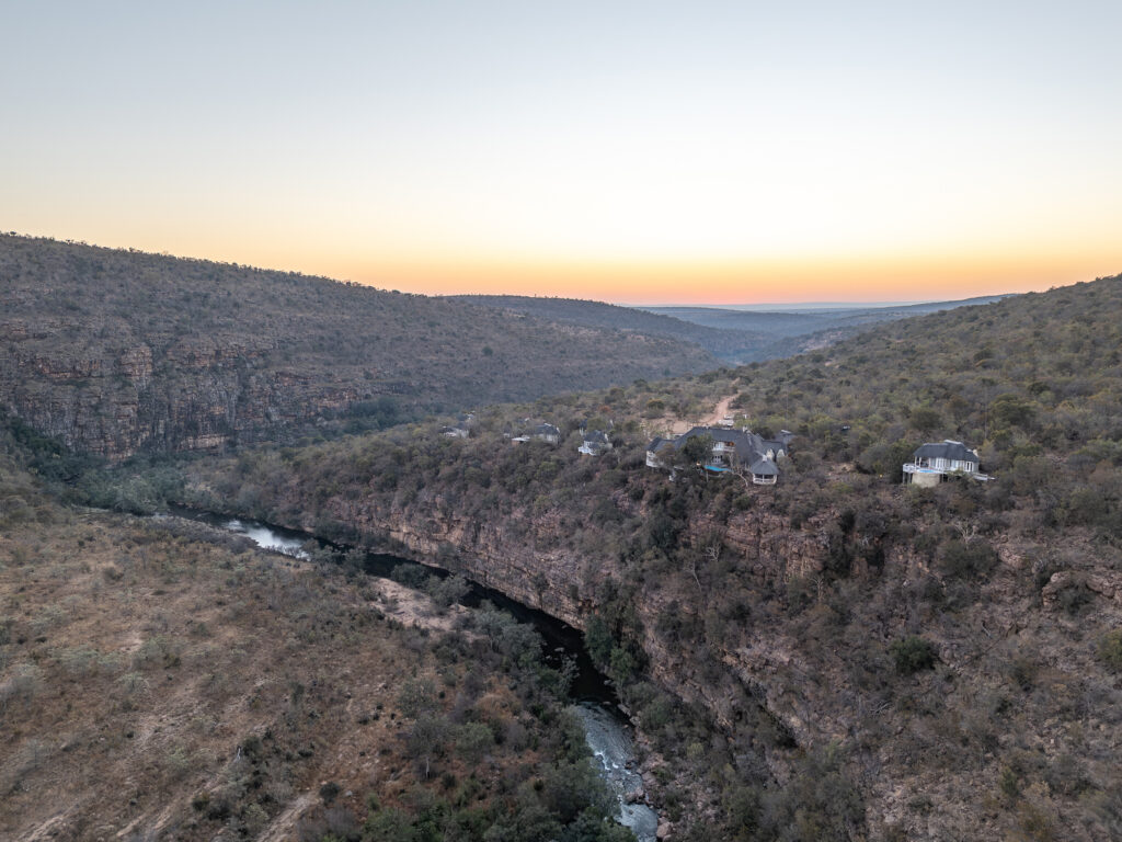 Clifftop Exclusive Safari Hideaway — aerial view, sunset