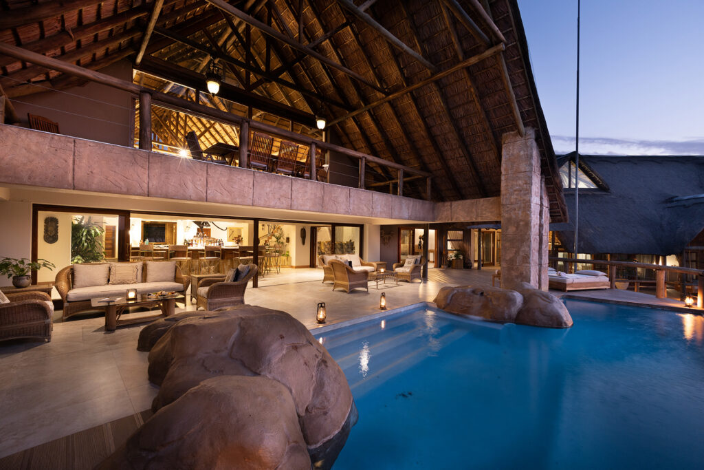 Kingfisher Villa Suites pool deck lit up
