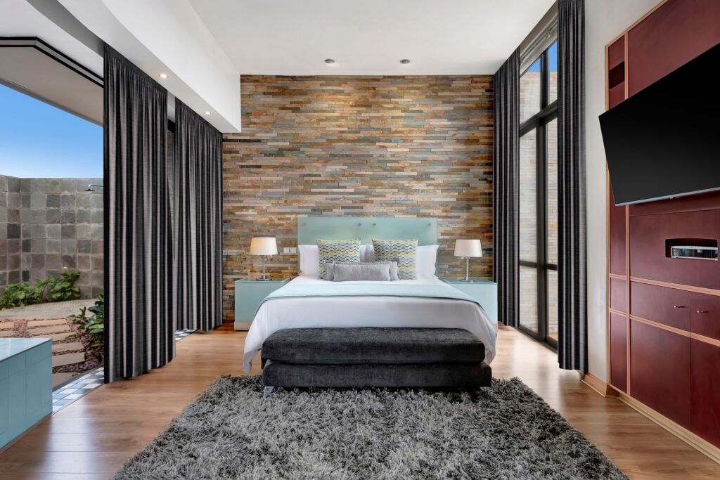 African Pride Melrose Arch, Autograph Collection – Penthouse Suite bed, tv, patio