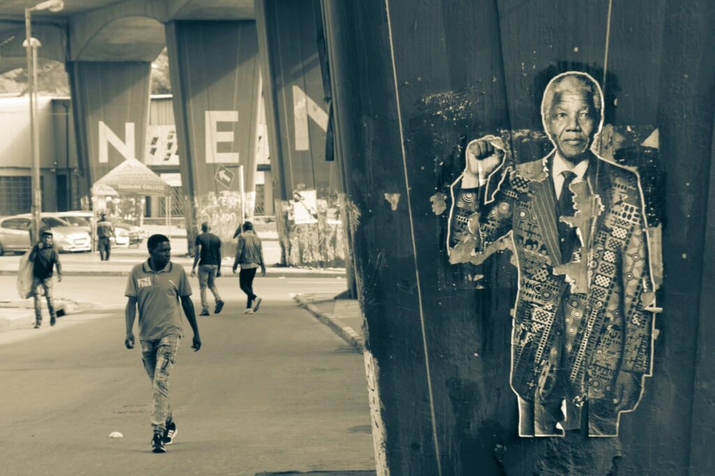 Walking past the Nelson Mandela mural in Soweto