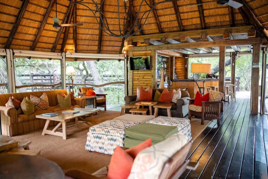 Kapama Buffalo Camp lounge and bar under a thatched roof