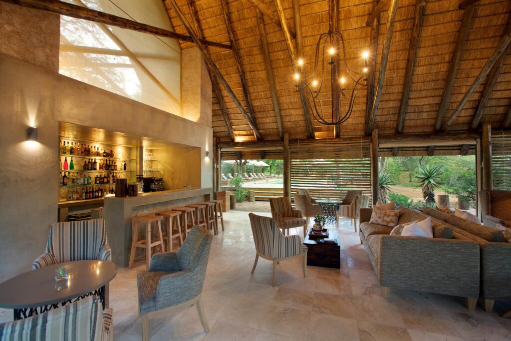 Kapama Southern Camp bar and lounge under thatch
